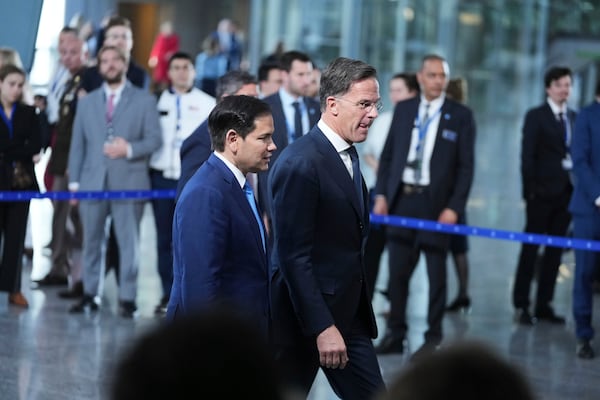 NATO Secretary General Mark Rutte, right, walks with United States Secretary of State Marco Rubio after addressing the media during a meeting of NATO foreign ministers at NATO headquarters in Brussels, Thursday, April 3, 2025. (AP Photo/Virginia Mayo)