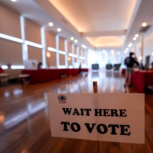 People vote in a runoff election at Park Tavern, Tuesday, June 16, 2026, in Atlanta. (AP Photo/Mike Stewart)