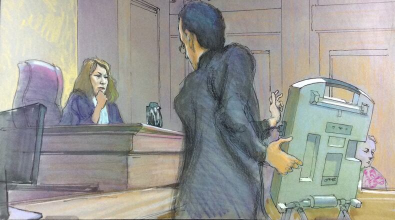 U.S. District Judge Amy Totenberg listened in a federal court hearing in September 2018 as Alex Halderman, a University of Michigan computer science professor, demonstrates how an electronic voting machine like those used in Georgia could be hacked. Totenberg is overseeing a lawsuit that asked her to invalidate Georgia’s 27,000 touchscreen voting machines and replace them with paper ballots. RICHARD MILLER / CONTRIBUTED