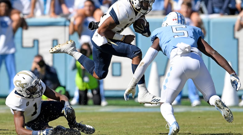 Patrice Rene (5) of the North Carolina Tar Heels looks to tackle Tobias Oliver of the Georgia Tech Yellow Jackets in the first half of their game at Kenan Stadium on November 3, 2018 in Chapel Hill, North Carolina.  (Photo by Grant Halverson/Getty Images)
