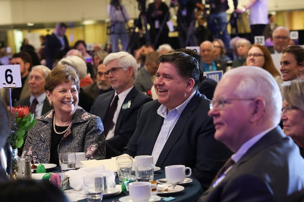 Illinois Gov. JB Pritzker, center, and Sen. Jeanne Shaheen, D-N.H., left, attend the McIntyre-Shaheen 100 Club Dinner, Sunday April 27, 2025, in Manchester, N.H. (AP Photo/Reba Saldanha)