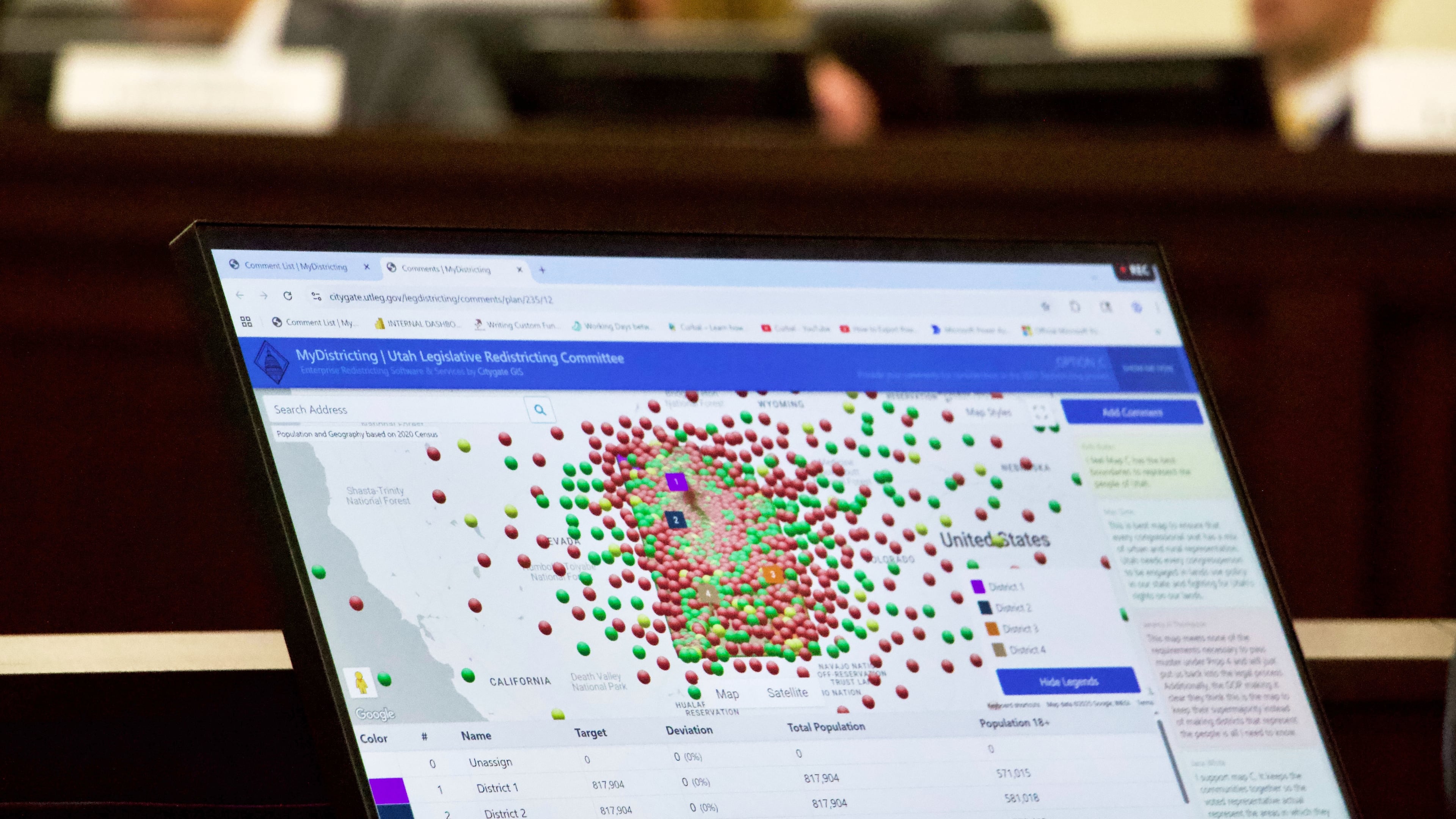 Lawmakers look at a display of public comments on their congressional redistricting proposals, Monday, Sept. 6, 2025, in Salt Lake City, Utah. (AP Photo/Hannah Schoenbaum)