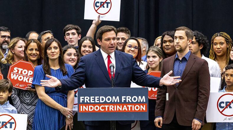 Florida Gov. Ron DeSantis signed House Bill 7, known as the Stop Woke bill, in Hialeah Gardens, Fla., on April 22, 2022. He is now targeting woke campuses. (Daniel A. Varela/Miami Herald/TNS)