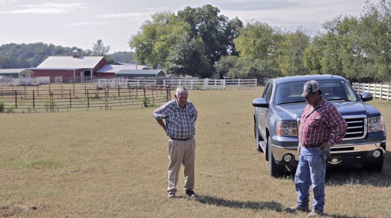 September 15, 2016 - Gordon County - Milton Stewart, 79, and his foreman, Rigo Orozco, discuss a spraying strategy for this field which they found to be infested with army worms. He has several hay fields in and around Gordon county that have been decimated by drought and army worms. Northwest Georgia is the hardest hit corner of drought-plagued Georgia. Some counties have lost 85% of hay and cotton crops to drought and army worms. BOB ANDRES /BANDRES@AJC.COM