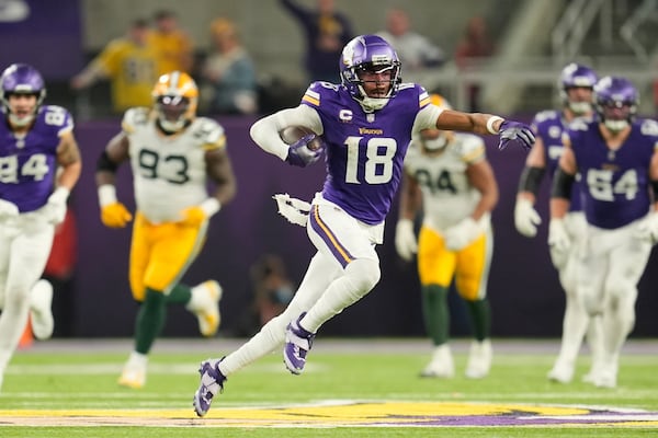 FILE - Minnesota Vikings' Justin Jefferson catches a pass for a first down during the second half of an NFL football game against the Green Bay Packers Sunday, Dec. 29, 2024, in Minneapolis. (AP Photo/Abbie Parr, File)