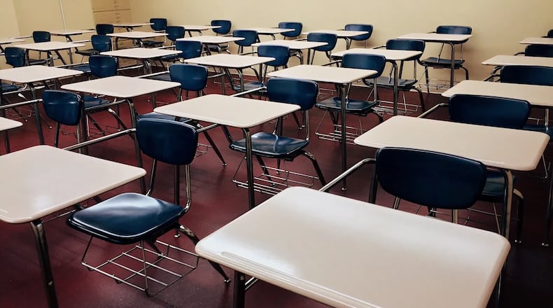 Classroom video shows Kennedy Road Middle School teacher Cassandra Barlow swinging a laptop cord at a student, missing, and hitting a second student in the head, Spalding County Sheriff Darrell Dix said.