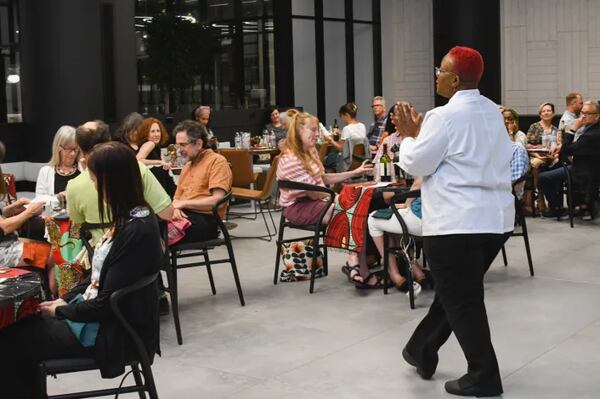 Chef Carmenia Morgan Tyrus speaks to diners at a recent Chow Club event.