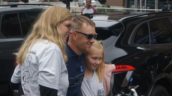 Redcay’s girlfriend, Corrie Brown, left, and his daughter, Jaiden, welcomed him back from his long ride. (Photo Courtesy of Bob Pepalis)