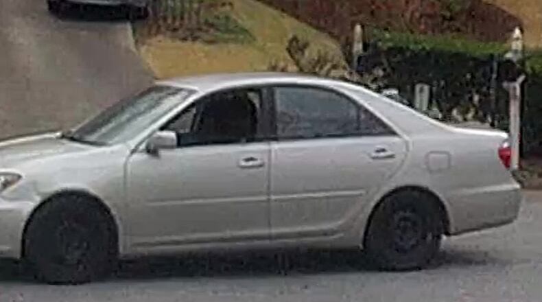Investigators are looking for a silver 2000s model Toyota sedan that was seen parked on St. Martin’s Lane before the shooting, according to Cobb County police. Photos of the vehicle were released Tuesday.