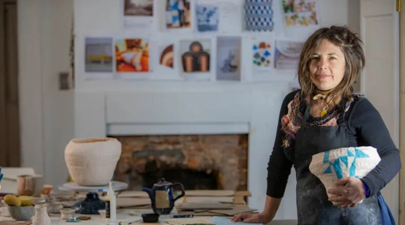 Artist K. Tauches in her studio. (Photo Courtesy of Isadora Pennington)