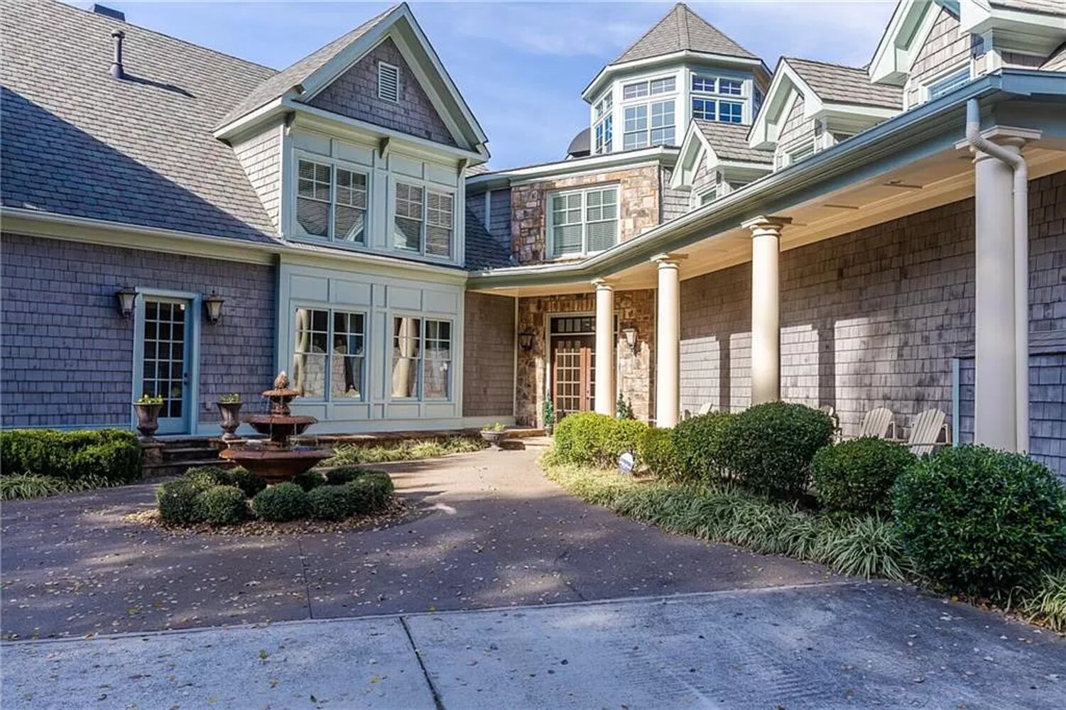 Enjoy resort-style living ITP at this $8.7M estate with private lake