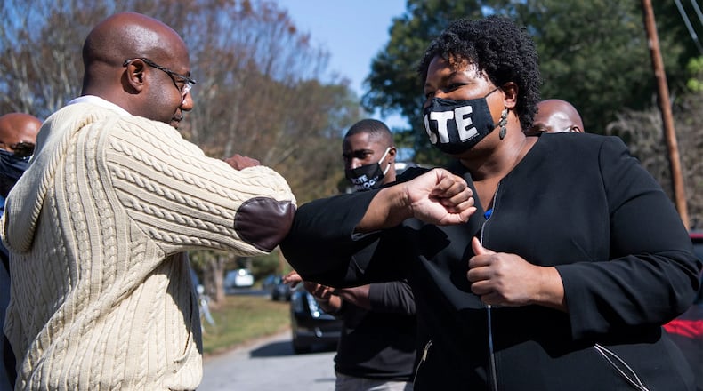 U.S. Sen. Raphael Warnock and Georgia gubernatorial Stacey Abrams will campaign together today. In the photo, they are greeting one another at a 2020 event. (File photo)