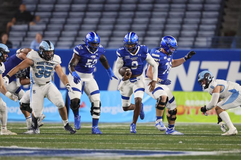 Georgia State quarterback Darren Grainger (3) runs for a long gain with blocks from offensive tackle Travis Glover (52, left) and offensive lineman Jonathan Brown (76) during the second half at Center Parc Stadium, Thursday, August 31, 2023, in Atlanta. Georgia State won 42-35. (Jason Getz / Jason.Getz@ajc.com)
