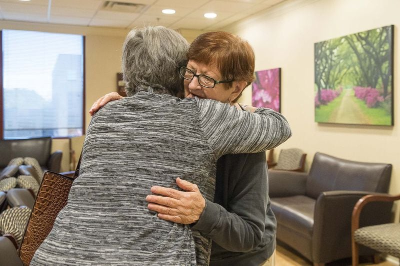 11/25/2019 — Fayetteville, Georgia — American Cancer Society’s Road To Recovery program driver Melissa Staton (left), 66, and Linda Wayman (right), 74, embrace before Linda’s chemotherapy appointment at the Piedmont Cancer Institute inside the Piedmont Fayette Hospital. (Alyssa Pointer/Atlanta Journal Constitution)