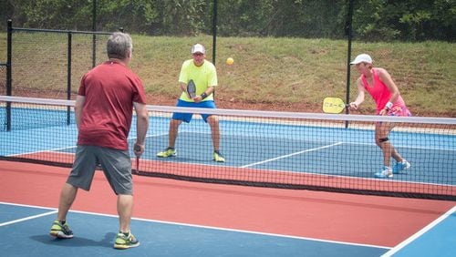 Pickleball, which is played with two or four players hitting a perforated plastic ball over a net with a paddle, is a fast-growing sport. Courtesy PTC-Fayette Pickleball Club