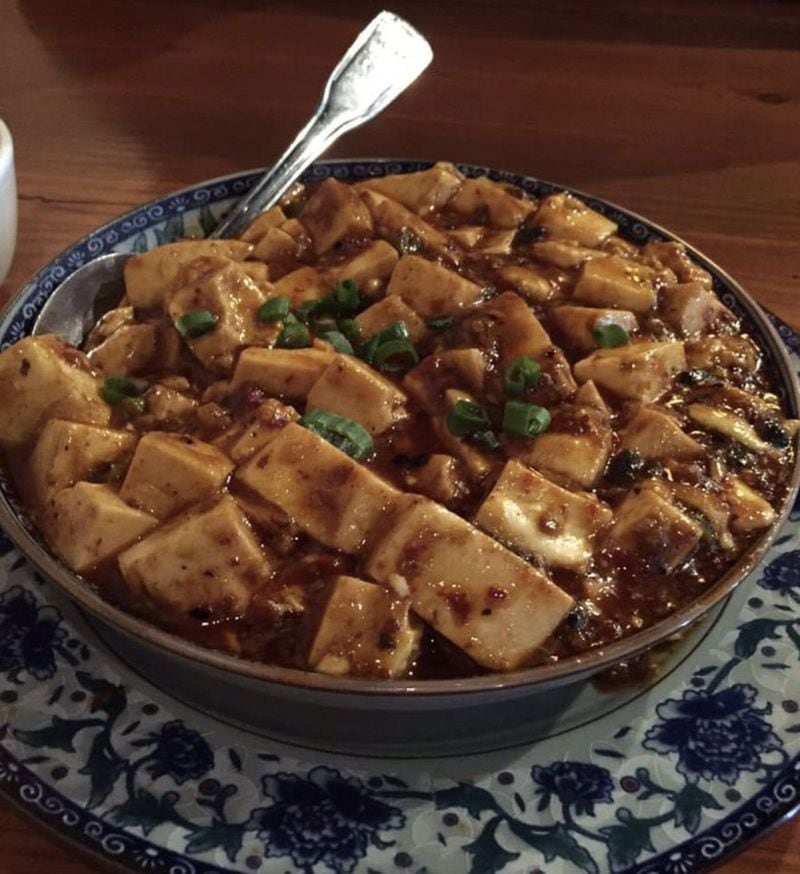 Silken soy swims in a sizzling sauce with salty black beans in Mapo Tofu. CONTRIBUTED BY CELINE LIN