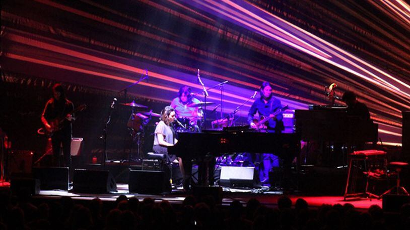 Norah Jones and her band spotlighted by a burst of color at the Fox Theatre. Photo: Melissa Ruggieri/AJC
