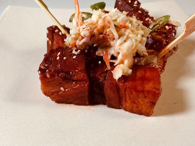 Pork belly skewers glazed with Asian barbecue sauce and served with lightly dressed coleslaw at Taffer’s Tavern.
Bob Townsend for the Atlanta Journal-Constitution.