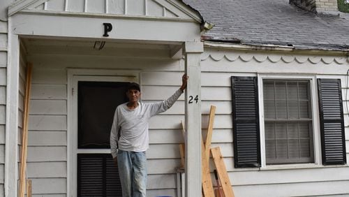 Willie Pierce, 73, stands in front of his home in the Kirkwood neighborhood of Atlanta. He has lived there for more than 40 years without air conditioning, but in the summer of 2022 received an air conditioning system installed by a local nonprofit.