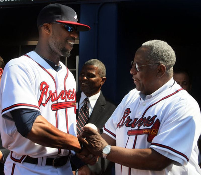 Atlanta Braves Jason Heyward chats with Hank Aaron before the home opener against the Chicago Cubs on April 5, 2010.