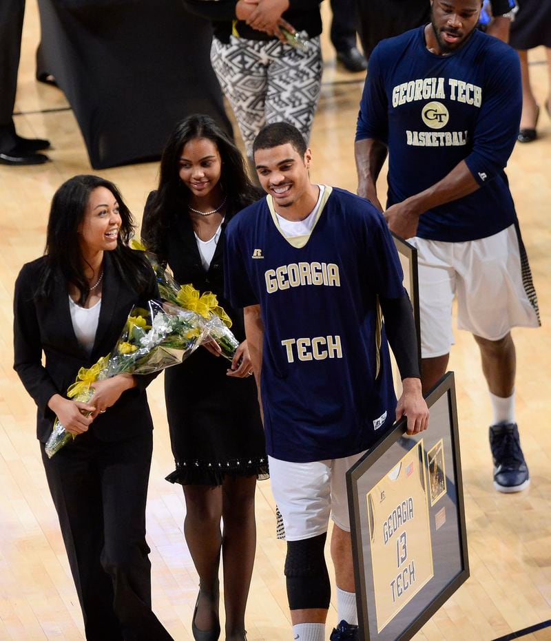 Georgia Tech forward Robert Sampson, center, walks with his sisters after a senior night presentation before the first half of an NCAA college basketball game Tuesday, March 3, 2015, in Atlanta. (AP Photo/David Tulis) On senior night, Tech forward Robert Sampson was forced to play small forward due to injuries to Marcus Georges-Hunt and Quinton Stephens. He finished with four points and five rebounds. (ASSOCIATED PRESS)
