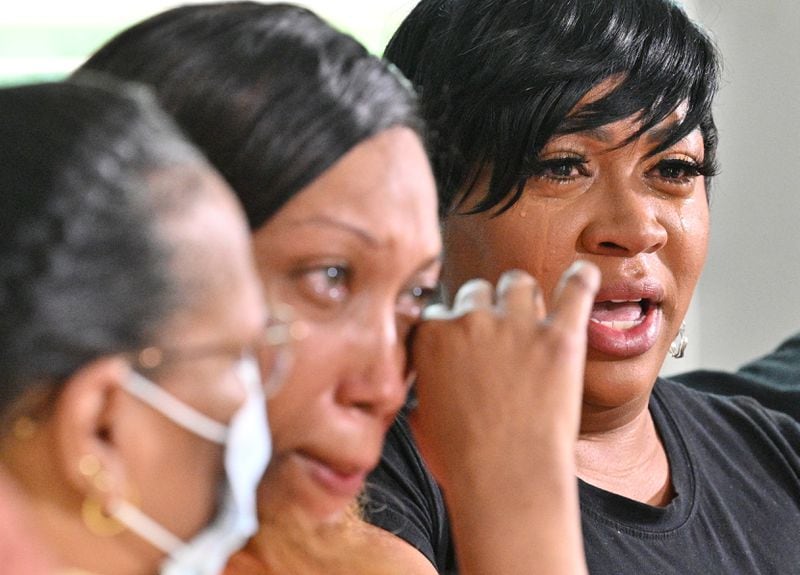 May 19, 2022 McDonough - Mya Cullins (right), mother of Nygil Cullins, speaks about her son as she sits with her Demietrice King (left), Nygil’s grandmother, and Paula Dixon, Nygil’s aunt, on Thursday, May 19, 2022. The family of a man shot and killed by Atlanta police at a crowded, upscale Buckhead restaurant are still looking for answers into what happened and what went wrong. Nygil Cullins, 22, was eating at Fogo de Chao, a Brazilian steakhouse in the 3100 block of Piedmont Road, Wednesday night when things took a turn. Atlanta police Deputy Chief Charles Hampton Jr. said restaurant staff called for help with handling an unruly patron. (Hyosub Shin / Hyosub.Shin@ajc.com)