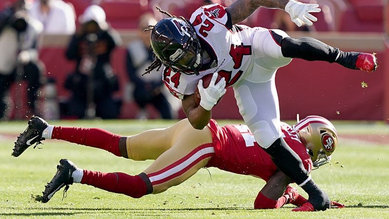 Falcons running back Devonta Freeman is knocked off his feet by 49ers defensive back Emmanuel Moseley during the first quarter Sunday, Dec. 15, 2019, at Levi's Stadium in Santa Clara, Calif.