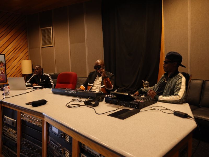 (L) Rico Wade, Patrick “Sleepy” Brown, and Ray Murray known professionally as “Organized Noize,” listen to new music at Stankonia Studios on Monday, June 5, 2023, in Atlanta. (Tyson A. Horne / Tyson.horne@ajc.com)