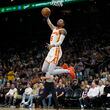 Atlanta Hawks guard Dejounte Murray dunks against the Phoenix Suns during the first half of an NBA basketball game Thursday, March 21, 2024, in Phoenix. The Hawks lost 128-115.  (AP Photo/Rick Scuteri)