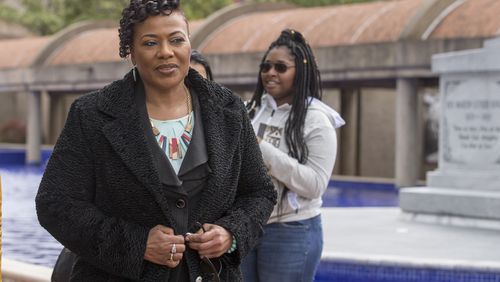 Bernice King, left, walks past the crypt of her parents, Martin Luther King Jr. and Coretta Scott King, on Wednesday. ALYSSA POINTER/ALYSSA.POINTER@AJC.COM