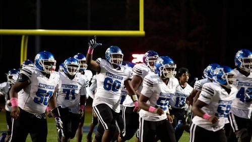 The Stephenson High School Jaguars take the field during a GHSA high school football game between Stephenson High School and Miller Grove High School at James R. Hallford Stadium in Clarkston, GA., on Friday, Oct. 8, 2021. (Photo/Jenn Finch)