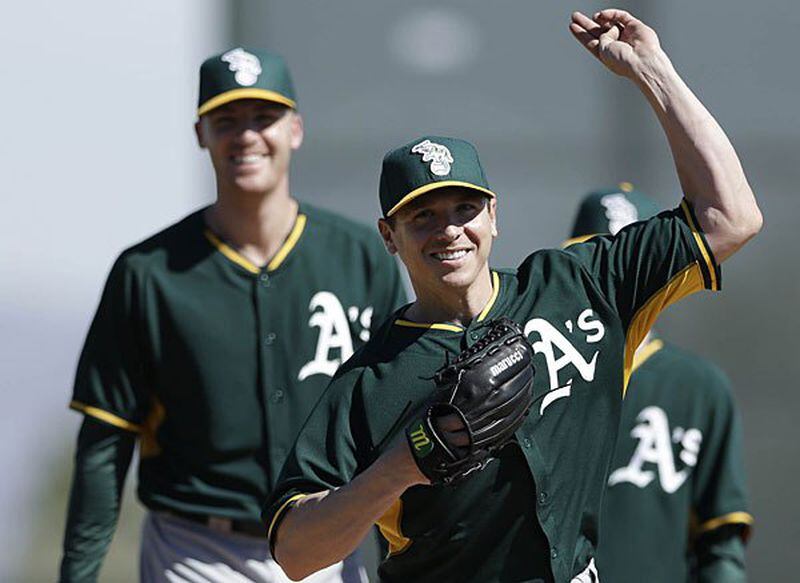 That's ex-Brave Eric O'Flaherty (left) behind Scott Kazmir, a pair of pitchers the A's added this winter. O'Flaherty was a huge contributor to the Braves since '09.