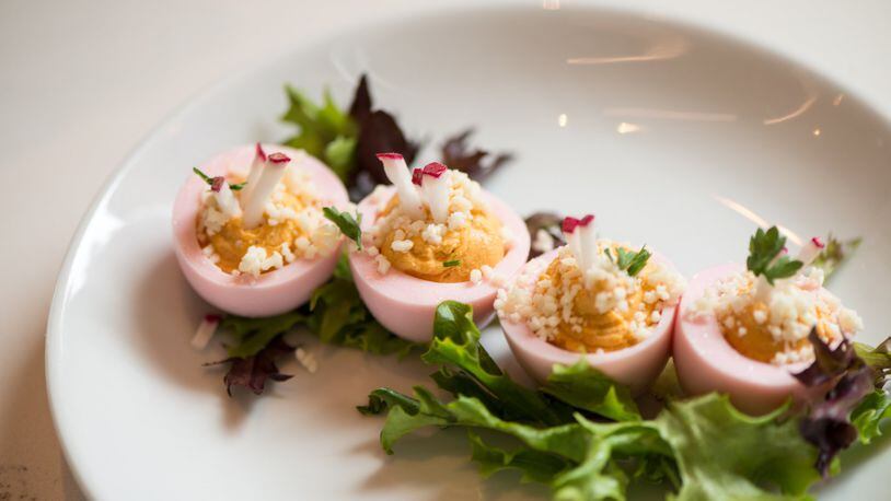 Full Commission Pink Deviled Eggs with beet wash, cotija cheese, and radish. Photo credit- Mia Yakel.