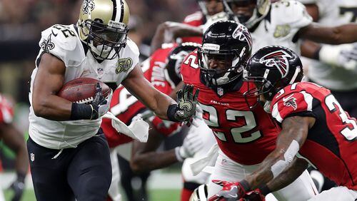 Mark Ingram of the Saints is tackled by Keanu Neal (22) of the Falcons at the Mercedes-Benz Superdome on September 26, 2016 in New Orleans, Louisiana. (Photo by Chris Graythen/Getty Images)