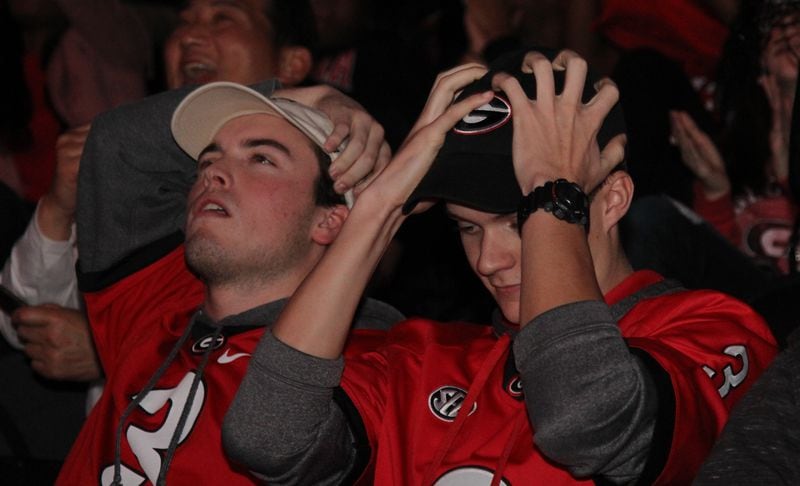 Georgia fans react to plays during the College Football National Championship watch party held at Stegeman Coliseum on the University of Georgia campus in Athens, Georgia on Tuesday, January 9, 2018. (REANN HUBER/REANN.HUBER@AJC.COM)