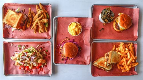 What you'll find at the new location of Fox Bros. Bar-B-Q on Atlanta's Upper Westside includes Texas Turkey (upper left), BBQ Wedge (lower left), Pulled Mushroom (center), Terlingua Pride (upper right), and Foxy Melt (lower right). (Chris Hunt for The Atlanta Journal-Constitution)