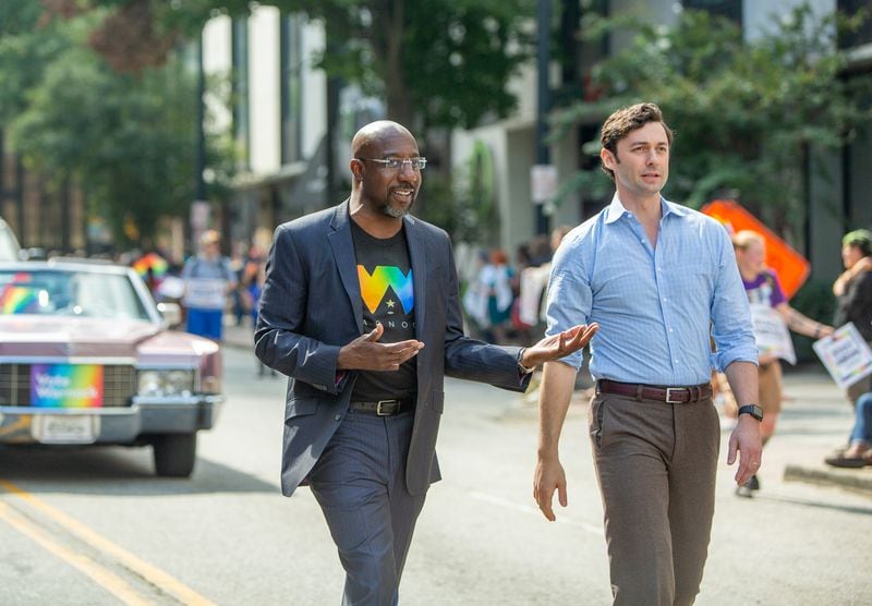 Democratic U.S. Sen. Raphael Warnock, left, marches with fellow Georgia U.S. Sen. Jon Ossoff in this year's Pride Parade in Atlanta. Warnock has long been a vocal supporter of LGBTQ rights. (Jenni Girtman for The Atlanta Journal-Constitution)