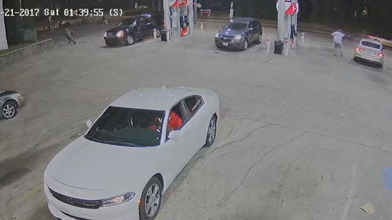 Police are searching for a man seen on video shooting into a car at a gas station. (Credit: Atlanta Police Department)