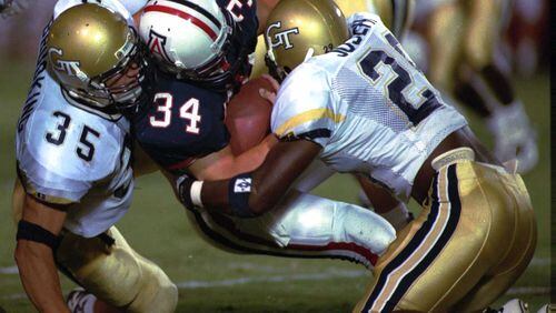 Georgia Tech great Keith Brooking (35) was named an ACC legend this week and will be honored at the ACC championship game in December in Charlotte, N.C. (AP Photo/John Miller)