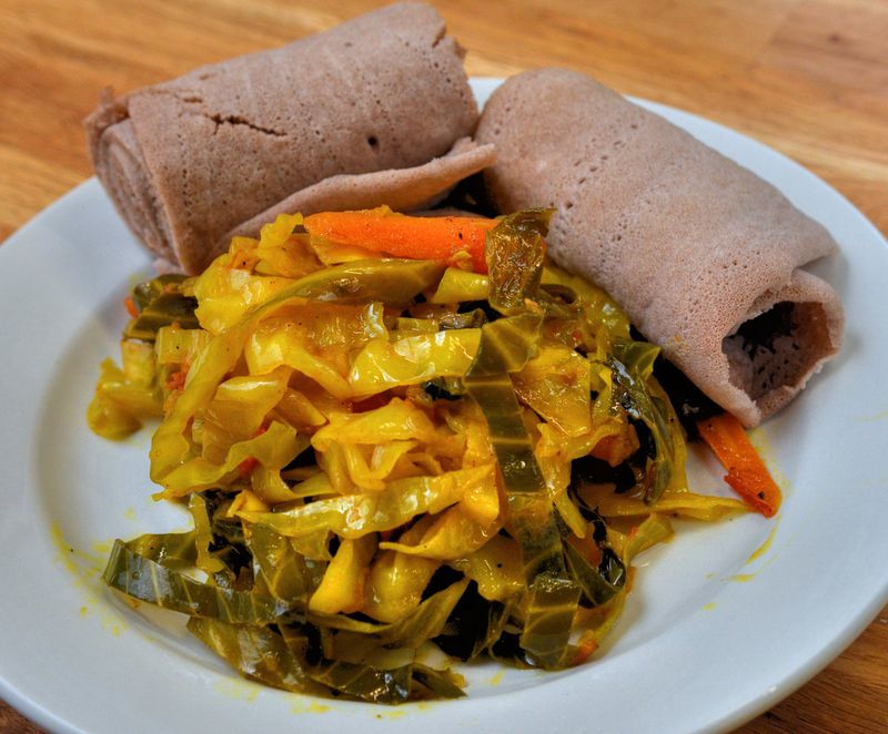 Yohana Solomon of Kushina Catering made this Tekel Gomen (Cabbage and Carrots), shown with injera. “It’s very simple to cook Ethiopian food and not intimidating at all,” she said. STYLING BY YOHANA SOLOMON / CONTRIBUTED BY CHRIS HUNT PHOTOGRAPHY