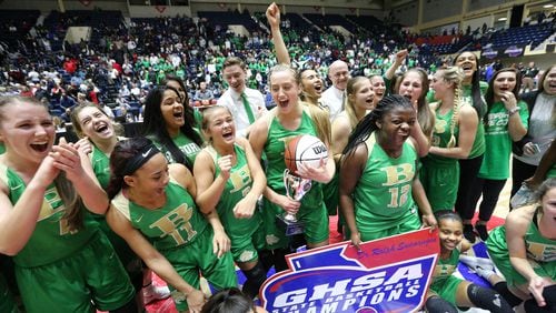 Buford gathers for their team photo and trophy presentation after winning the GHSA state basketball championship game on Thursday, March 8, 2018, in Macon.