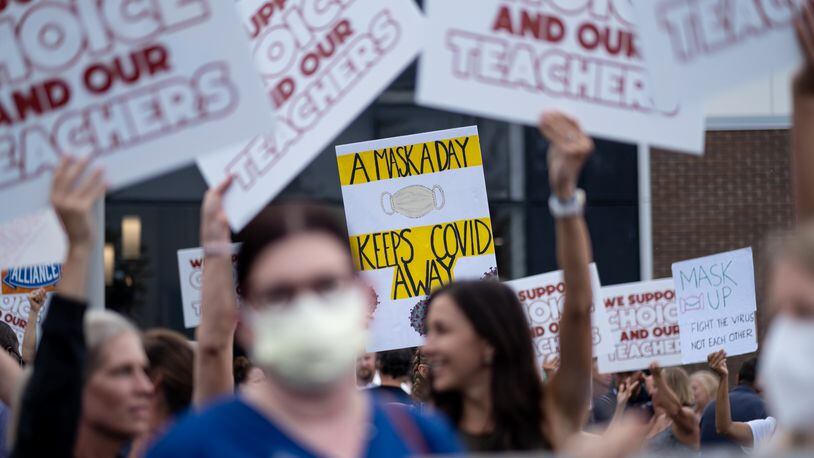 People in favor of and against a mask mandate for Cobb County schools gather and protest ahead of the school board meeting on Aug. 19, 2021 in Marietta. Ben Gray for the Atlanta Journal-Constitution
