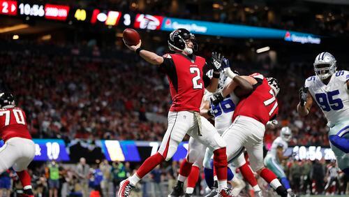 Atlanta Falcons quarterback Matt Ryan (2) works against the Dallas Cowboys during the first half of an NFL football game, Sunday, Nov. 12, 2017, in Atlanta. (AP Photo/David Goldman)
