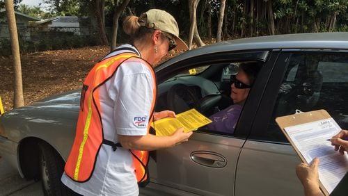 CarFit volunteer Lucy Mead of North Palm Beach, Florida, speaks with Shirley Hennessey  during a session to make recommendations on how Hennessey can make her car more safe and comfortable at the Mae Volen Senior Center in Boca on Dec. 6, 2016.