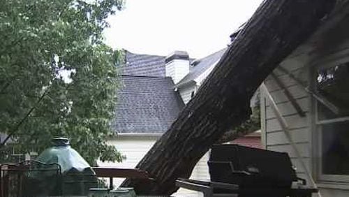 A tree crashed into Alpharetta Councilman Dan Merkel’s home Saturday.