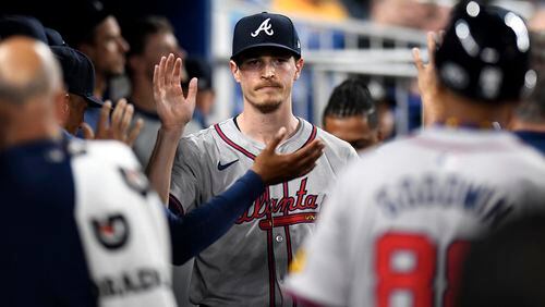 Atlanta Braves pitcher Max Fried is greeted after working in the seventh inning against the Miami Marlins in a baseball game Friday, April 12, 2024, in Miami. The Braves beat the Marlins 8-1. (AP Photo/Michael Laughlin)
