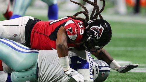 Falcons defensive end Adrian Clayborn records the fifth sack of Cowboys quarterback Dak Prescott during the second half in a NFL football game on Sunday, November 12, 2017, in Atlanta. The Falcons beat the Cowboys 27-7.   Curtis Compton/ccompton@ajc.com