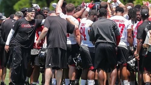 May 12, 2018 Flowery Branch: Atlanta Falcons head coach Dan Quinn huddles up with the rookies at the conclusion of the second day of rookie mini-camp on Saturday, May 12, 2018, in Flowery Branch.  Curtis Compton/ccompton@ajc.com
