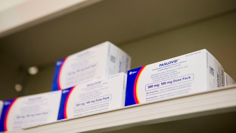 Paxlovid, a Covid-19 treatment medication, sits on the shelf of Little Five Points Pharmacy on Friday, December 23, 2022, in Atlanta. Pharmacist Ira Katz distributes Paxlovid to those with a prescription. CHRISTINA MATACOTTA FOR THE ATLANTA JOURNAL-CONSTITUTION.