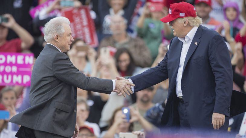 MOBILE, AL - DECEMBER 17: President-elect Donald Trump greets Senator Jeff Sessions, Trump's picks for attorney general, during a thank you rally in Ladd-Peebles Stadium on December 17, 2016 in Mobile, Alabama. President-elect Trump has been visiting several states that he won, to thank people for their support during the U.S. election. (Photo by Mark Wallheiser/Getty Images)